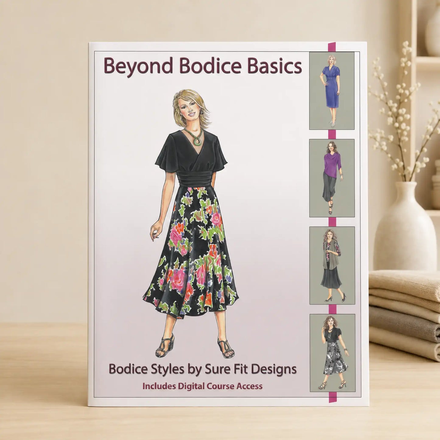 A sewing pattern booklet titled 'Beyond Bodice Basics' standing on a light wood surface. The cover shows an illustration of a woman wearing a black top and a colorful floral skirt, with four smaller outfit examples along the right side.