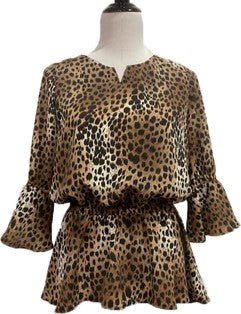 A cougar print loose blouse on a mannequin