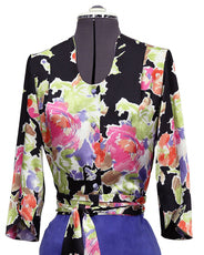 Colorful floral-patterned top on a mannequin with a blue skirt.