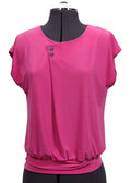 Pink blouse on a mannequin against a plain background