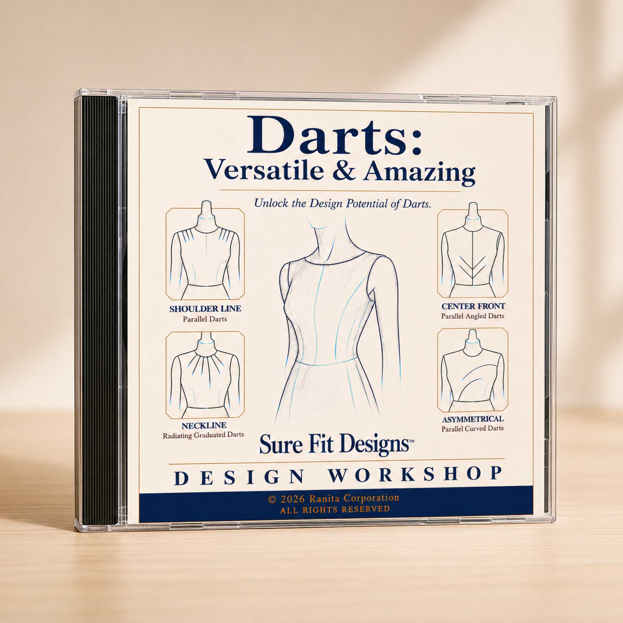A CD case for 'Darts: Versatile & Amazing' Sure Fit Designs Design Workshop, standing upright on a light wood surface against a warm beige background.