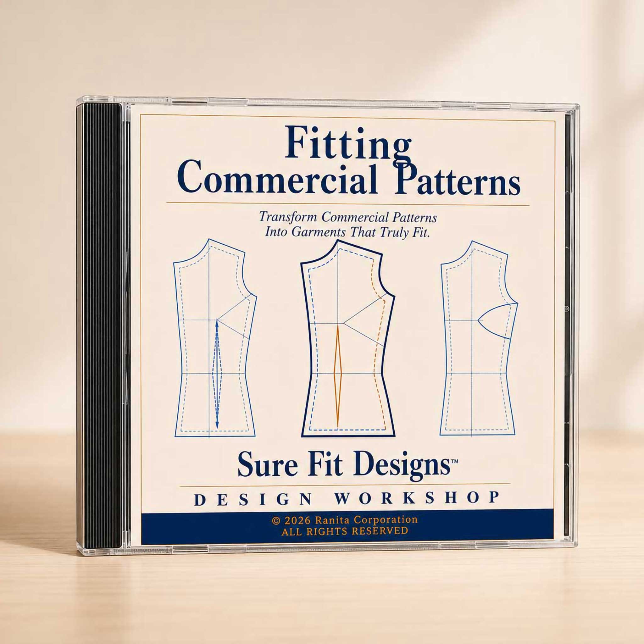 A CD case for 'Fitting Commercial Patterns' by Sure Fit Designs, featuring three garment pattern diagrams on the cover, photographed on a light wooden surface against a warm beige background.