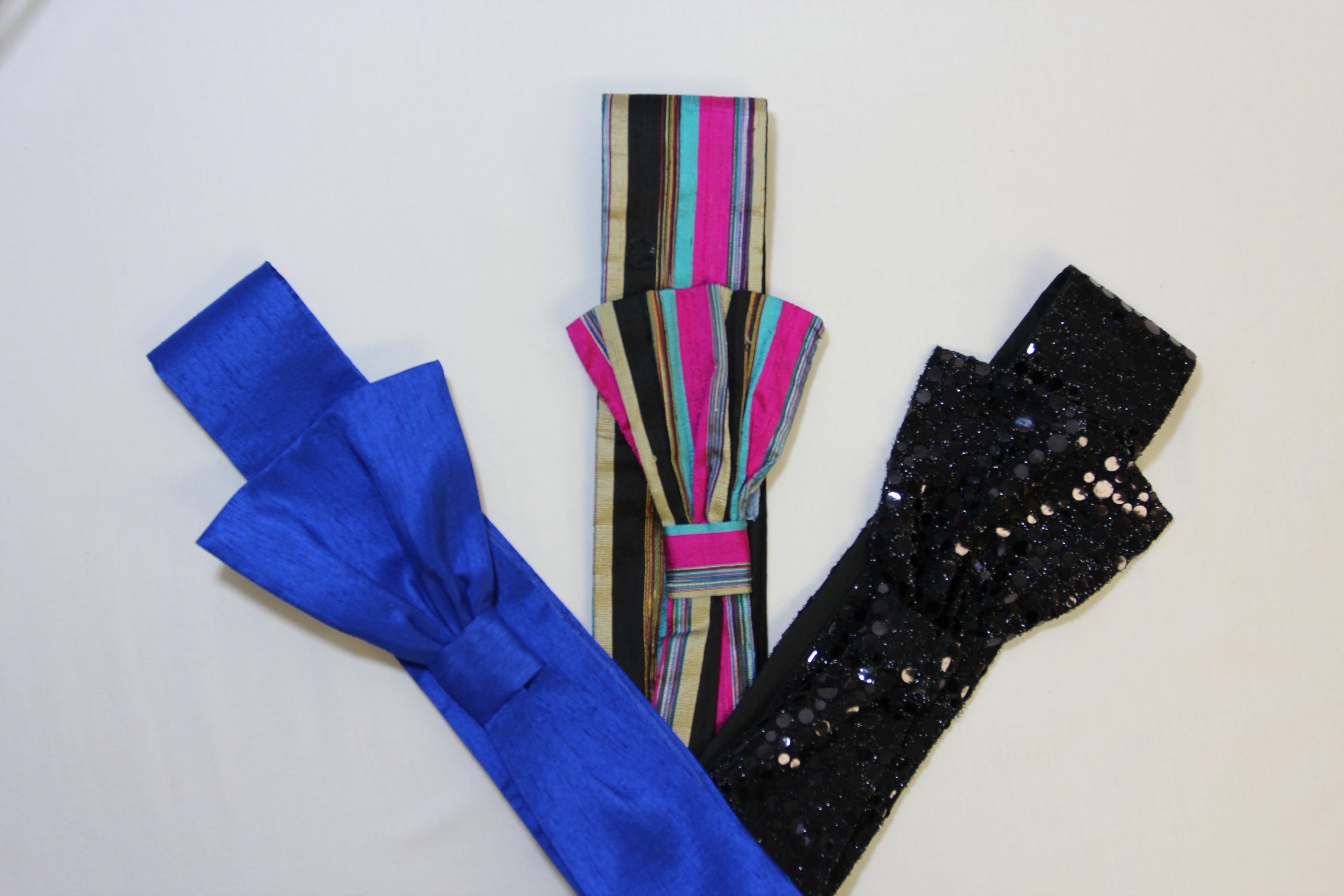 Three colorful headbands on a white background
