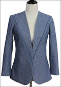 Blue patterned blazer on a mannequin against a white background