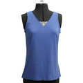 Blue sleeveless top on a mannequin with a green background