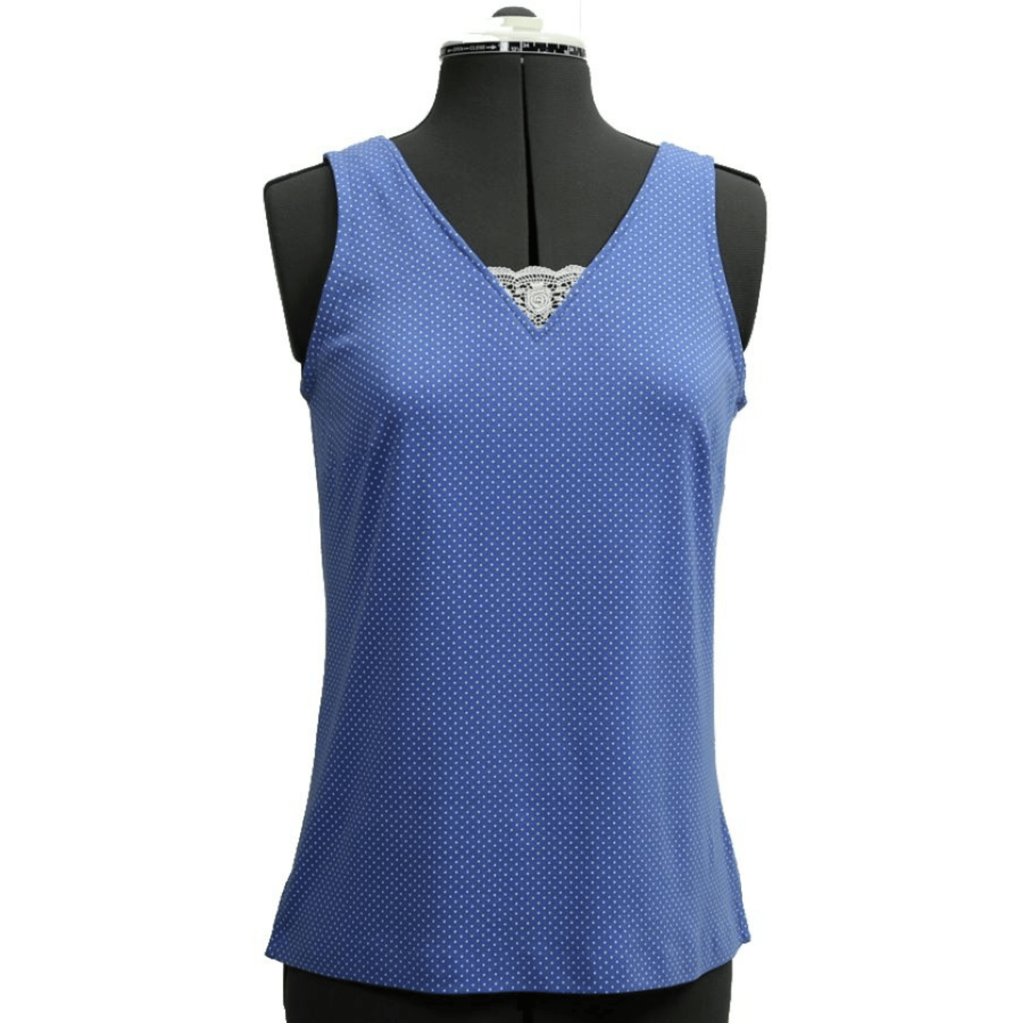 Blue sleeveless top on a mannequin with a green background