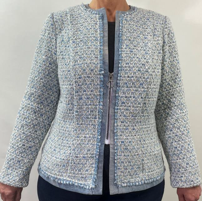 Light blue textured jacket with a zipper on a plain background