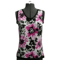 Floral tank top with pink and black flowers on a mannequin against a green background