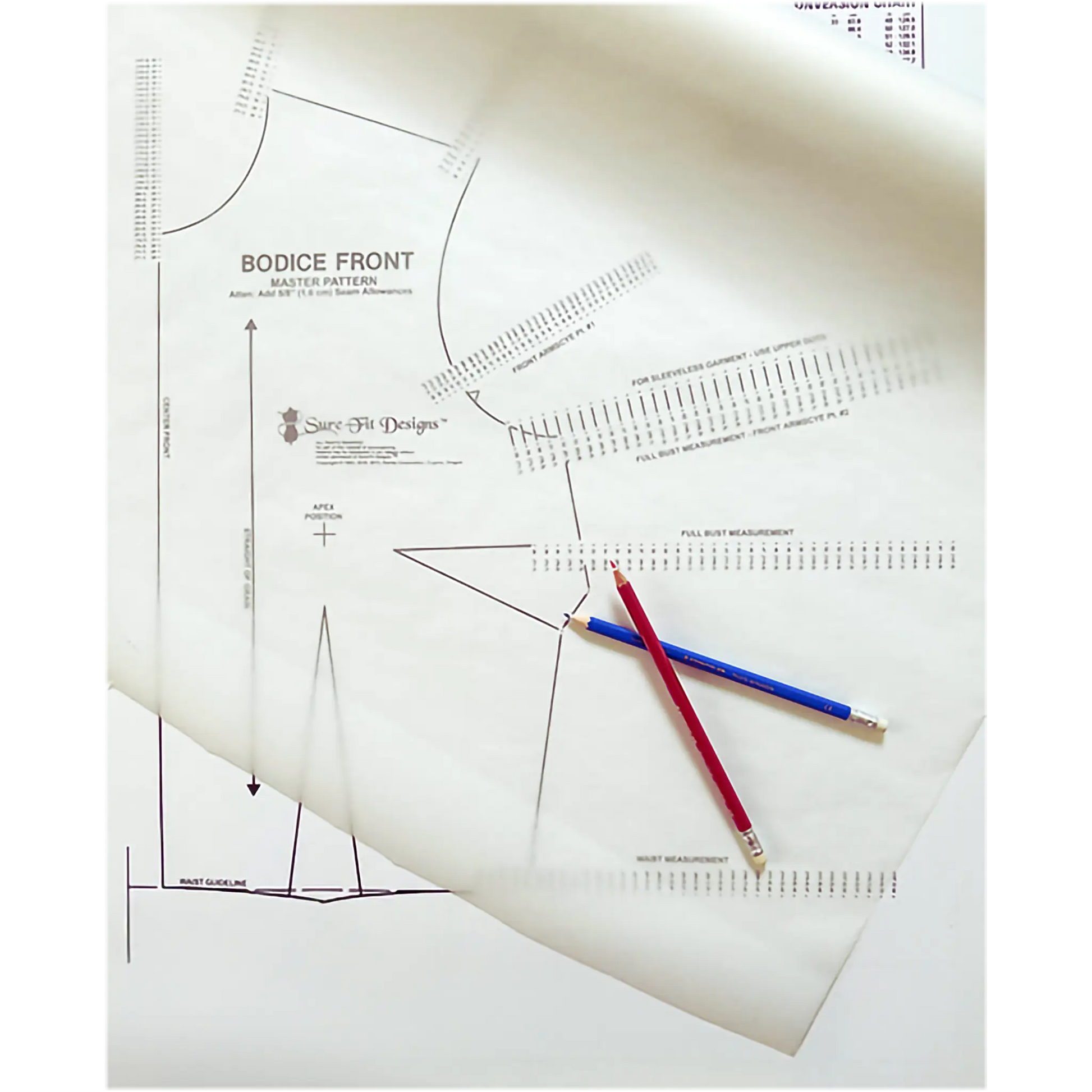 A close-up of sewing pattern paper with printed bodice front measurements and guides, overlaid with two pencils, one red and one blue.
